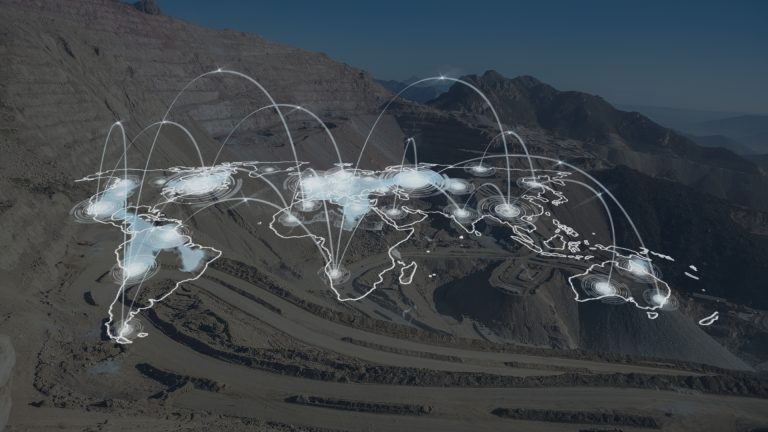 A digital overlay of a world map with connected nodes, set against a mining site in the background.